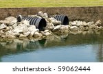 Drainage Pipes Going Into A Lake