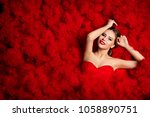 Small photo of Fashion Model on Red Flounce Waves Background, Woman Beauty Portrait, Beautiful Girl over Ruffle Dress Fabric