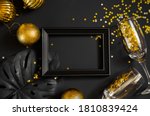 new year and christmas black background and gold decorations. background for text in a frame for a party