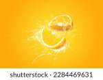 Small photo of Creative layout made from Fresh Sliced oranges and Orange fruit and water Splashing on a orange background.