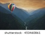 Air balloons flying over mountain
