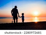 Small photo of Happy father and child fishermen catch fish by the sea on nature silhouette travel