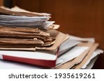 Small photo of Old yellowed manuscripts lie in a stack, beautiful paper background, there is place for text. A book typed on a manual typewriter was brought to the publishing house to publish a book