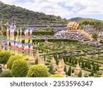 Small photo of Pattaya, Thailand - August 27nd 2023: The French Garden and Dinosaur Park at Nong Nooch Wonder World at Pattaya, Thailand. Nong Nooch is a large park with gardens, flowers, architecture and animals.