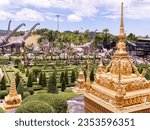 Small photo of Pattaya, Thailand - August 27nd 2023: The French Garden and Dinosaur Park at Nong Nooch Wonder World at Pattaya, Thailand. Nong Nooch is a large park with gardens, flowers, architecture and animals.