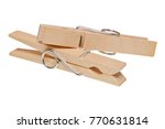 Wooden clothes pegs isolated on a white background