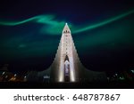 Northern lights shining over the church in Reykjavik Iceland
