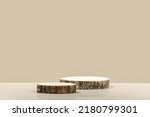 Small photo of Round wooden saw cut cylinder shape on beige background abstract background. Minimal box and geometric podium. Scene with geometrical forms. Empty showcase for eco cosmetic product presentation
