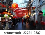 Small photo of Chinatown, London UK - 04 21 2023: Junction of Gerrard and Macclesfield Streets with lion sculpture on right.