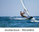 Young man surfing the wind on a ...