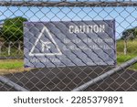 Airport Environment - Airport fence with a warning sign 