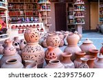 Small photo of Omani Souvenirs. Hand Made Pottery in Nizwa Market. Clay Jars at the Rural Traditional Arabic Bazaar, Oman. Arabian Peninsula.