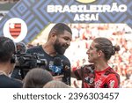 Small photo of Rio, Brazil - Dezember, 03 2023, Filipe Luis and Olivinha (basketball) player in match between Flamengo vs Cuiaba by Brazilian championship of 37th round, in Maracana Stadium