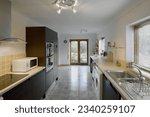 Small photo of colour image kitchen in newly restored rebuilt house work surfaces