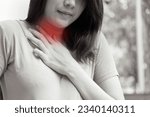 Small photo of sick woman with indigestion problem, acid reflux or gerd symptoms; woman health care, body care, sickness, pain, acid reflux, pneumonia, virus disease concept; 20s young adult asian woman model