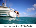 Man Diving From Catamaran Deck...