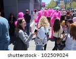 Small photo of SAN FRANCISCO, CA - MAY 12: Colorful pink "gorillas" promote the famous Zazzle Bay-to-Breakers Race to tourists at the Embarcadero on May 12, 2012, in San Francisco, California.