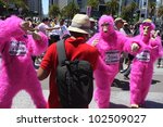 Small photo of SAN FRANCISCO, CA - MAY 12: Colorful pink "gorillas" promote the famous Zazzle Bay-to-Breakers Race to tourists at the Embarcadero on May 12, 2012, in San Francisco, California.