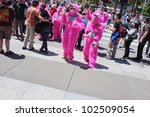 Small photo of SAN FRANCISCO, CA - MAY 12: Colorful pink "gorillas" promote the famous Zazzle Bay-to-Breakers Race to tourists at the Embarcadero on May 12, 2012, in San Francisco, California.