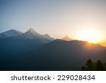 Small photo of View of sunrise at Himalaya mountains. Annapurna I, Annapurna South and Machapuchare mountain (Fishtail) within eyeshot. Poon hill, Ghorepani, Nepal.