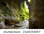 Hike in slot mossy canyon in Vancouver island, Canada