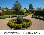 Small photo of ARUNDEL, UK - MAY 5TH 2018: A view inside the beautiful gardens at Arundel Castle in West Sussex, on 5th May 2018. The Fitzalan Chapel can be seen in the background.