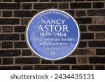 Small photo of London, UK - February 19th 2024: A blue plaque on a building in St. James's Square in London, UK, marking where Nancy Astor once lived. Astor was the first woman to sit in Parliament.