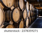 Small photo of Yerevan, Armenia - October 2, 2023: brandy barrels in NOY brandy factory cellars in Yerevan. Noy is the oldest Yerevan factory for production of Armenian cognac, it was founded in 1877