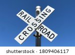 A Railroad Crossing Sign In...
