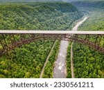 bridge over a gorge and river in New River Gorge National Park and Preserve in West Virginia. Taken from a bird's eye view.