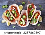 Small photo of Jack fruit vegan tacos. Overhead view on a dark stone background. Healthy eating, plant-based pulled pork meat substitute.