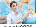 Small photo of Young Woman Travel Agent Concept
