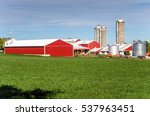 Farm With Red Barns  Silos And...