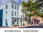 Historic Buildings with Shops and Restaurants in Old Town Alexandria, VA, on a Sunny Day.