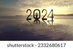Small photo of Silhouette of young woman exercising yoga while doing meditation with 2024 new year numbers on the beach at sunrise time