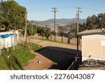 Small photo of Ensenada, Baja California, Mexico - February 15, 2023: Side street in a poorer district overlooking the city.