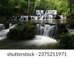 Small photo of Sam Lan waterfall consists of a large terrace with rocks stacking in three layers looking like a staircase, which is the name of the waterfall. Namtok Sam Lan National Park ,Saraburi Province,Thailand