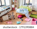 Small photo of mess, disorder and interior concept - view of messy home kid's room with scattered stuff