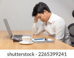 Small photo of Man with narcolepsy is fall asleep on office desk. Narcolepsy is a sleep disorder that makes people very drowsy during the day.