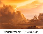 golden clouds in dramatic light at sunset/sunrise