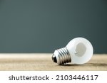 Small light bulb with a broken hole, concept for unsuccessful, problem or mistaken idea, misunderstanding to make a wrong decision