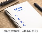 2024 Year with list of things to do as note on the notebook, new year resolutions, 2024 goal setting