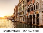 Ca' d'Oro palace (Golden House) at sunset, Venice, Italy. It is landmark of Venice. Beautiful view of Grand Canal in Venice city center in sunlight. Scenery of old buildings in evening. Travel theme.