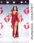 Small photo of New York, NY - February 7, 2019: Jordyn Woods wearing dress by Population walks runway for Red Dress Collection 2019 Go Red for Women at Hammerstein ballroom