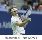 Small photo of New York, NY USA - August 28, 2017: Alexander Zverev of Germany returns ball during US Open Championships day match against Darian King of Barbados at Billie Jean King Tennis center
