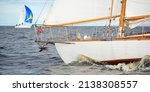 Small photo of Old expensive vintage wooden sailboat (yawl) close-up, sailing in an open sea. Stunning cloudscape. Coast of Maine, US