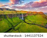 View from flying drone. Captivating summer view of Seljalandsfoss waterfall. Colorful sunrise in Iceland, Europe. Beauty of nature concept background.