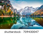 First snow on Braies Lake. Colorful autumn landscape in Italian Alps, Naturpark Fanes-Sennes-Prags, Dolomite, Italy, Europe. Beauty of nature concept background. 