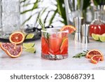Small photo of Red Sicilian Orange Paloma Cocktail of tequila, fresh lime and rosemary with red Sicilian orange juice. This cocktail is full of bright citrus aromas and herbs. Indulge your palate excellent drink.
