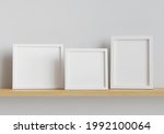 three photo mockup frames shelf.... | Shutterstock . vector #1992100064